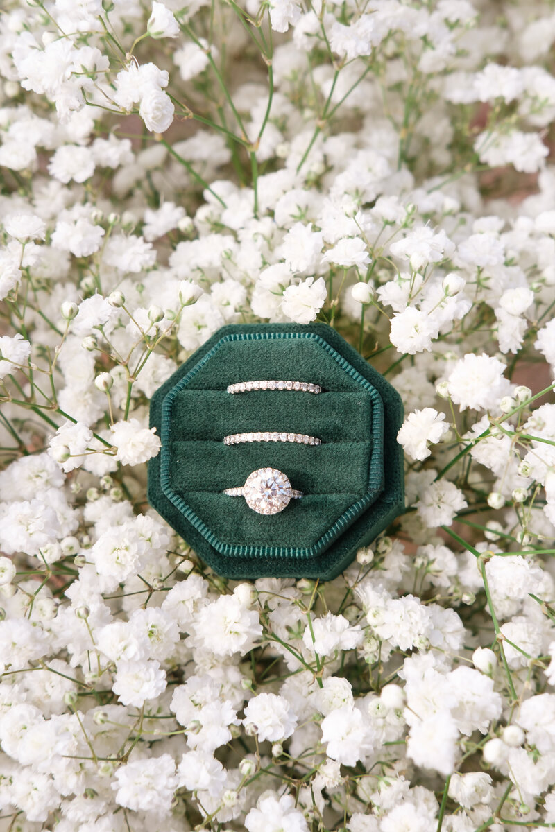 Dad holds his newborn son close to his chest and closes his eyes