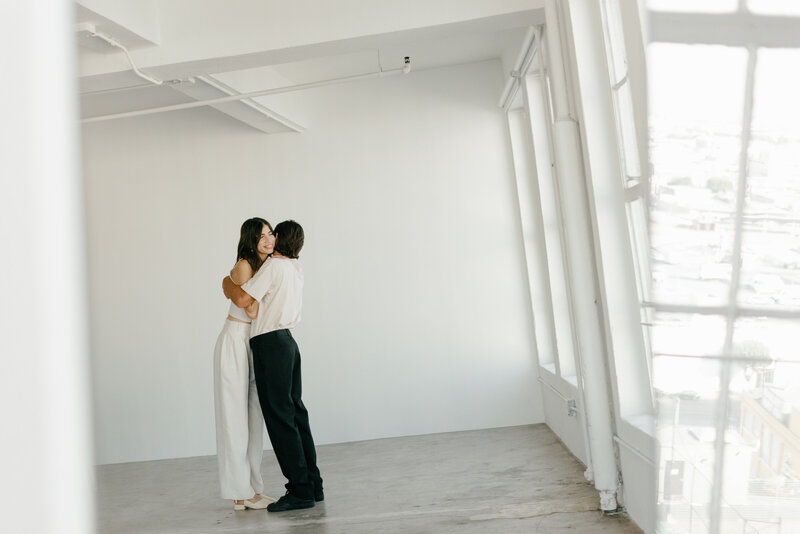 Engaged couple pose for portraits