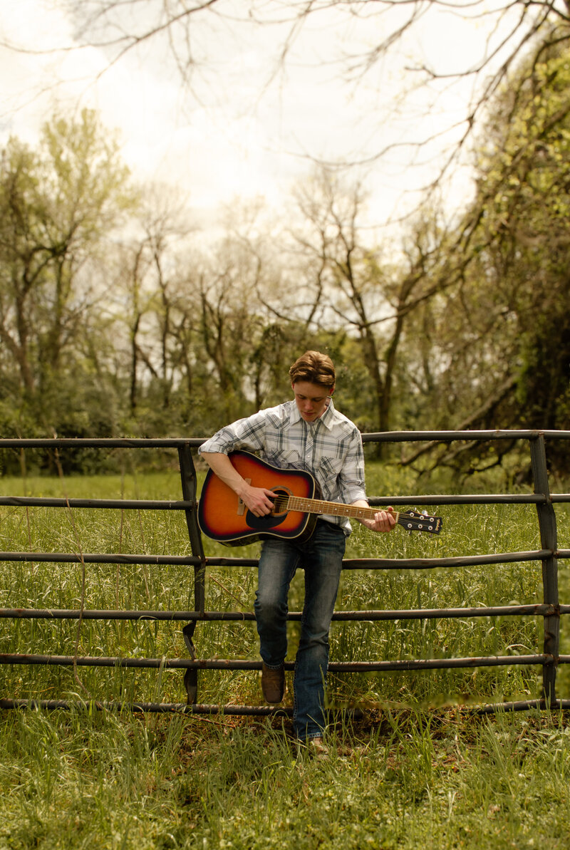 senior photo boy hobbie pose 