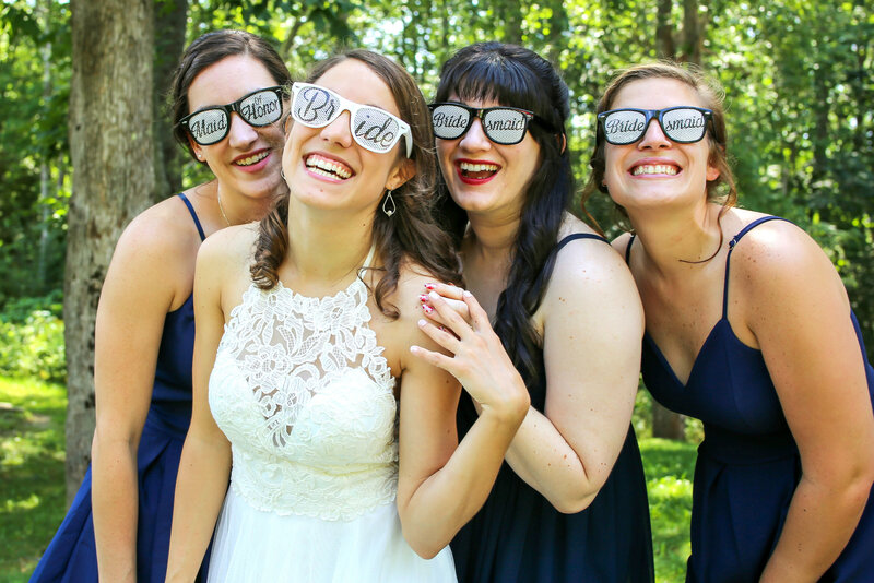 Bride and Bridesmaid wearing funny sunglasses | Bar Harbor Wedding