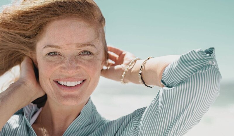 Confident , Smiling Midlife Woman  Auburn Hair  Close-Up