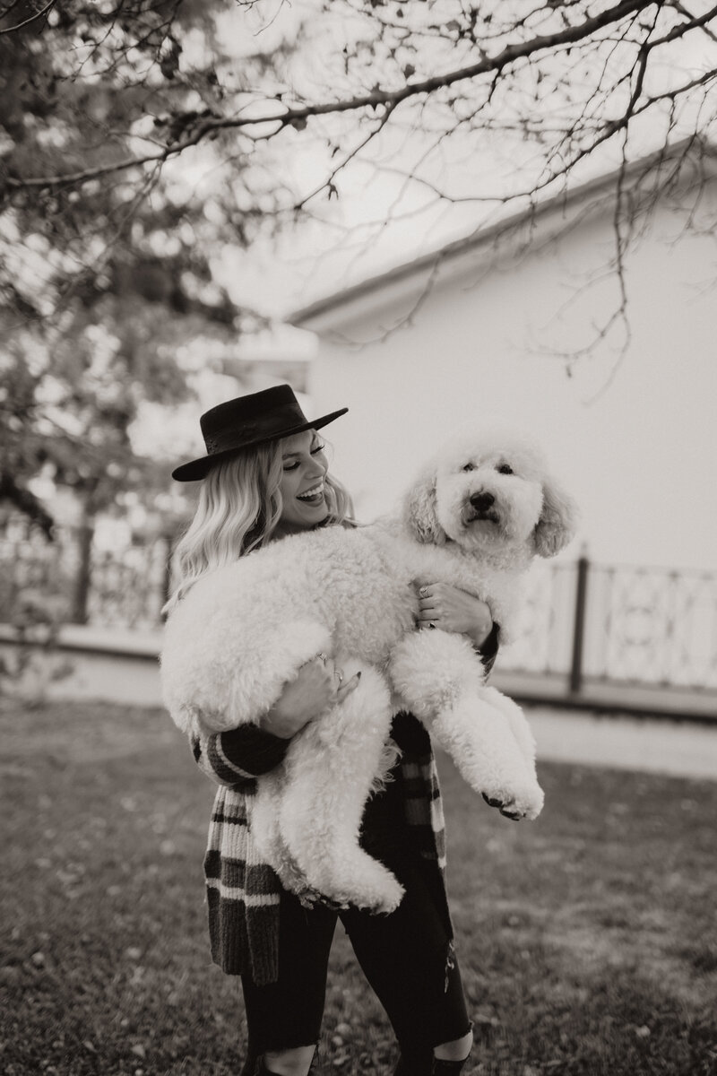 Kylee Grace holding her dog, Ozzy