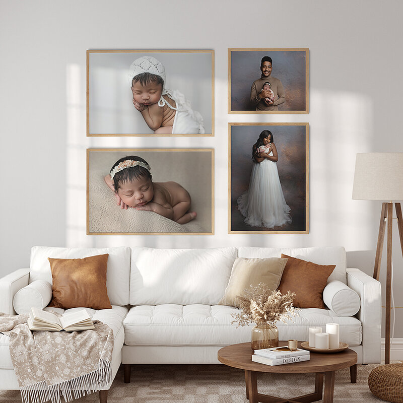Fine art newborn photography hangs on a wall in a living room