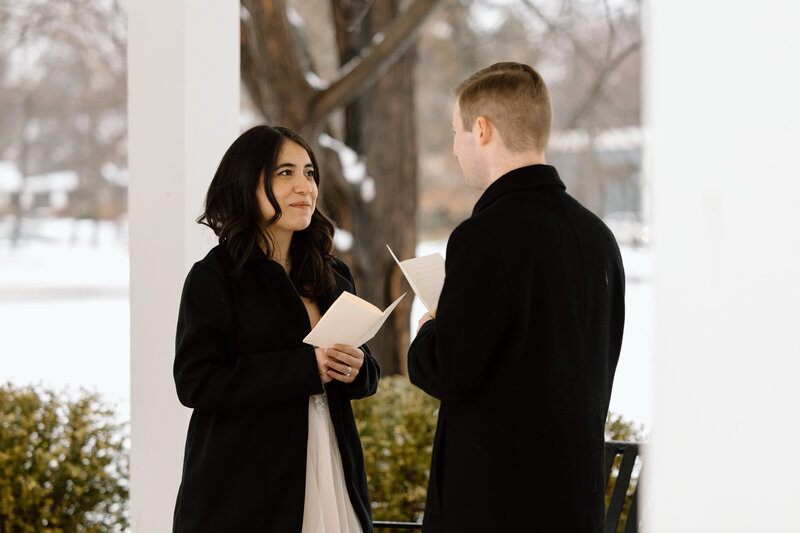 Bride and groom saying their vows during a winter elopement in Kent, Ohio.