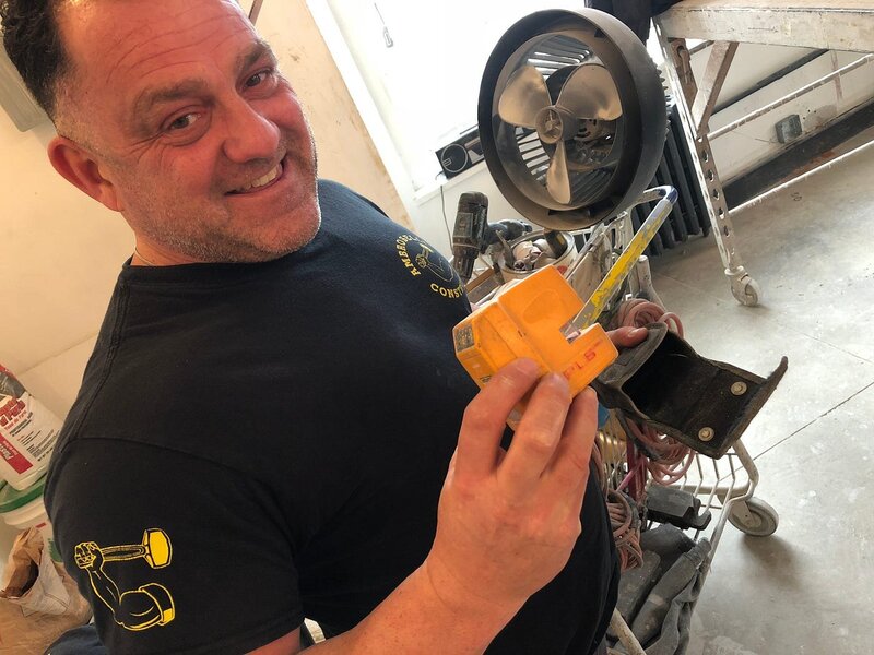 Michael Ambroselli, founder of Ambroselli Construction, standing confidently on a NYC job site.