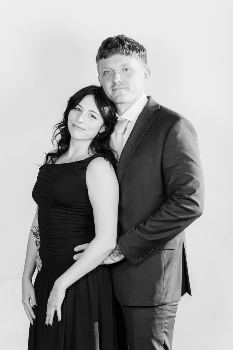 Elegant black and white portrait of a couple dressed in formal attire, captured at a Vogue Portrait photo booth in Richmond, VA.