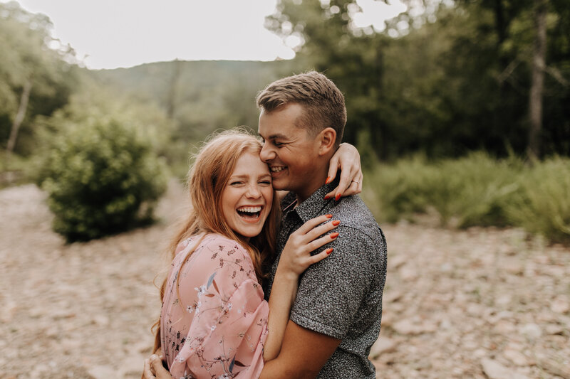 Couple laughing together during their engagement
