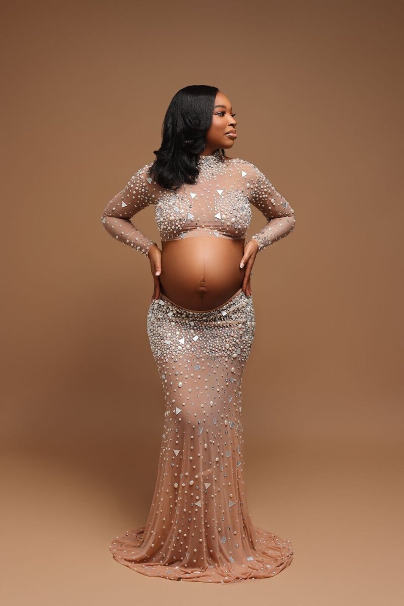 Expectant mother in a glamorous dress