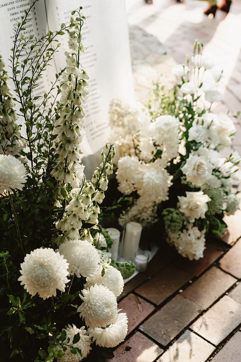 Woman  setting up table with flowers and candles