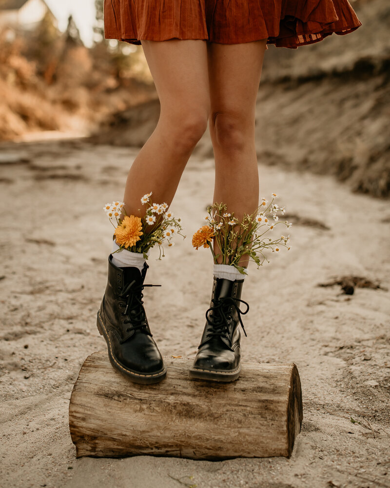Flowers sprouting out of Doc Marten boots.