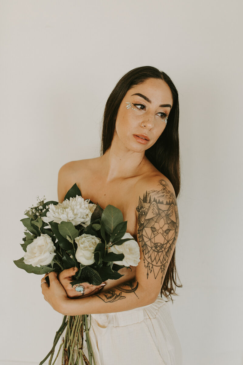 woman posing with flowers