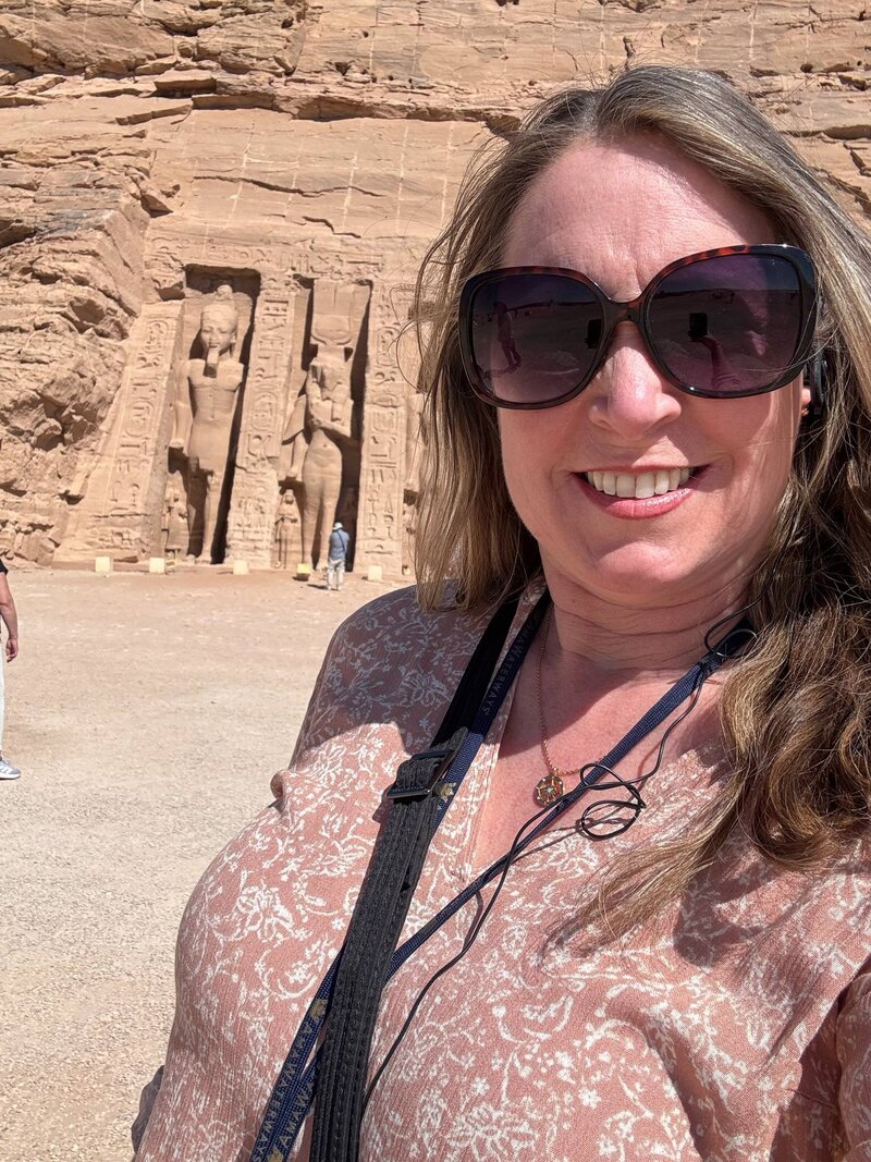 Terra from Adventures by Terra standing in front of Nefertari Temple at Abu Simbel in Aswan Egypt