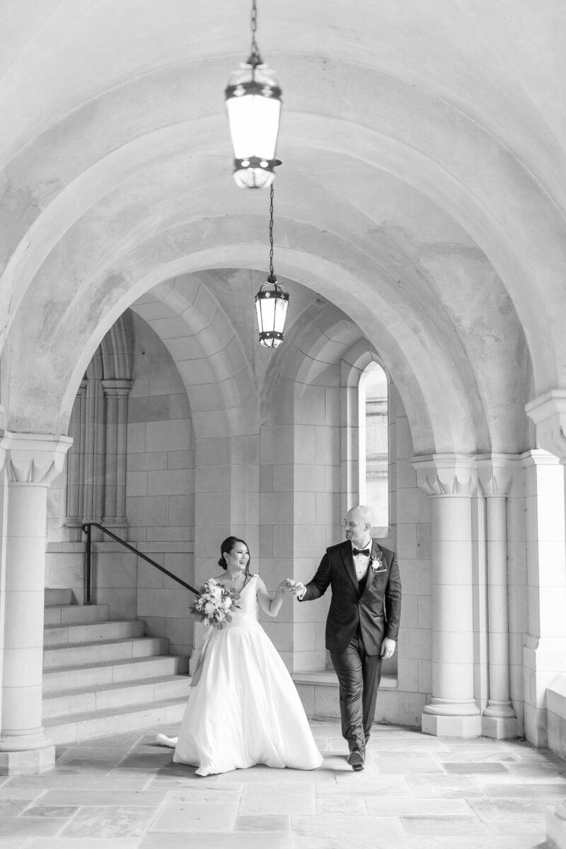 Bride and groom walk up memorial steps at their DC wedding