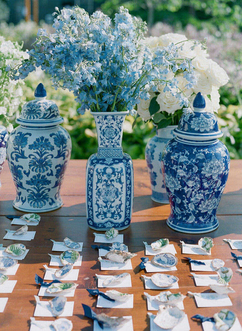 luxury escort card display with ornate blue vases
