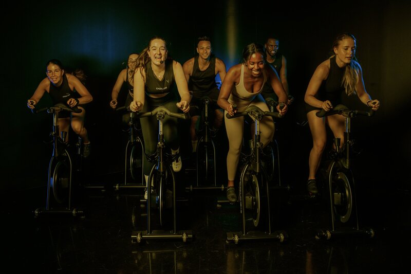 Spin class at Cycologie, a unique 45-minute experience in a candle-lit, beat-driven atmosphere.