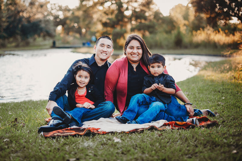 Outdoor family portrait by a lakeside in Winter Garden, Florida.