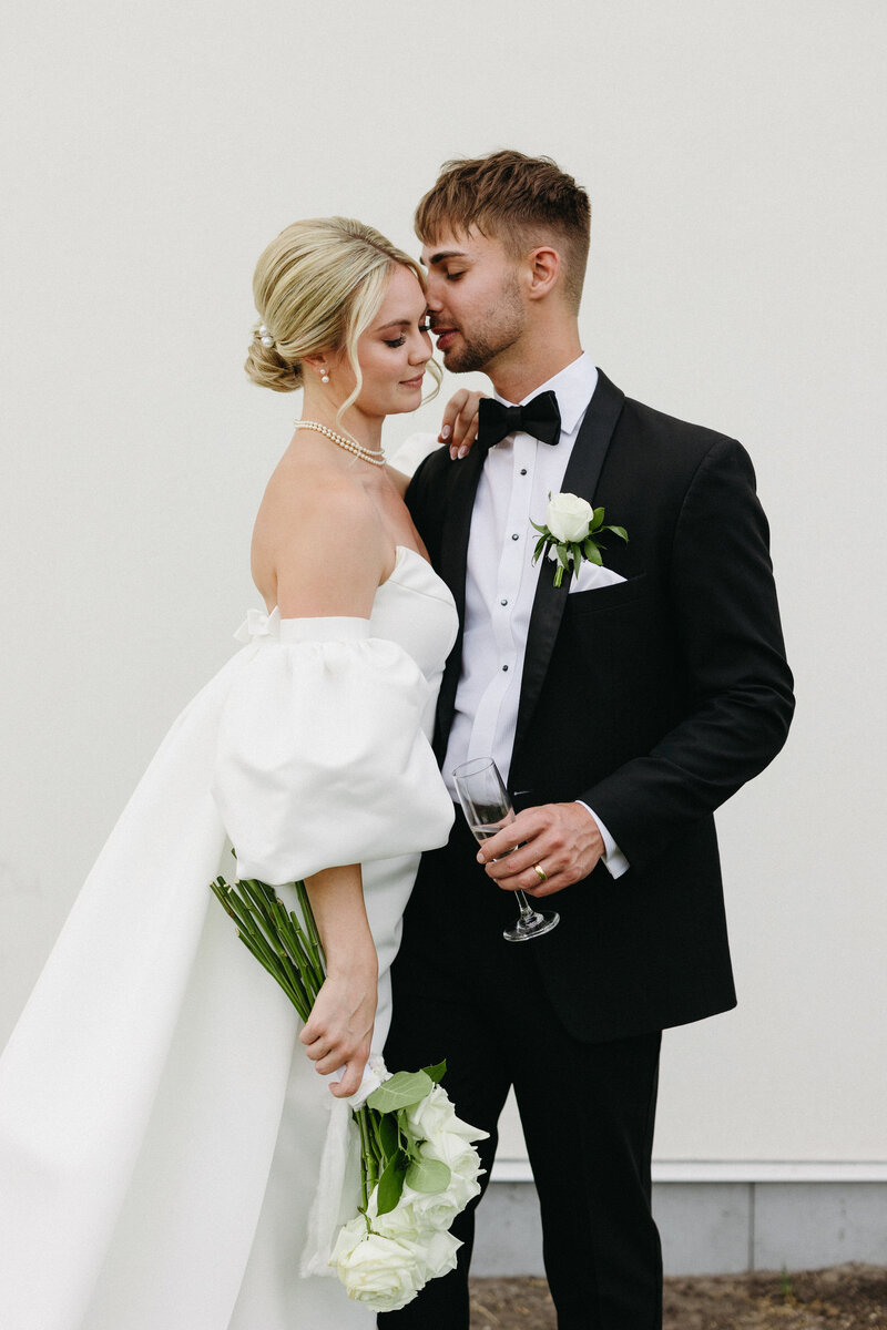 Editorial Couple Long Stem White Roses and Champagne