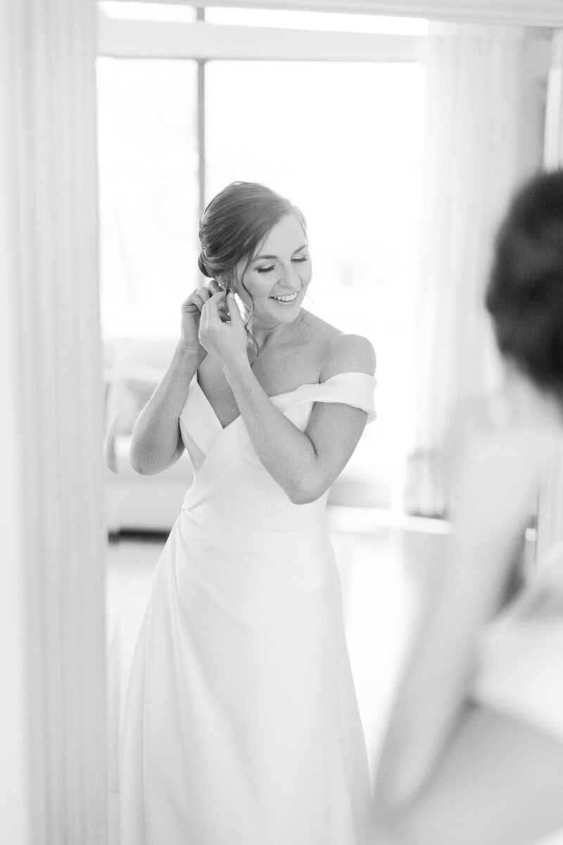 Bride getting ready in Canyonwood Ridge bridal suite with natural light and soft details