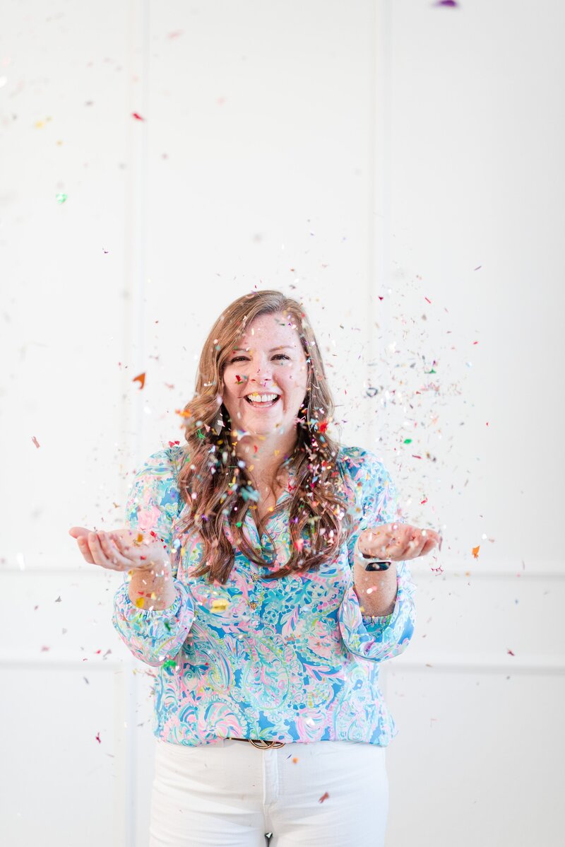 melissa throwing confetti celebrating another photographer seo win  for a client