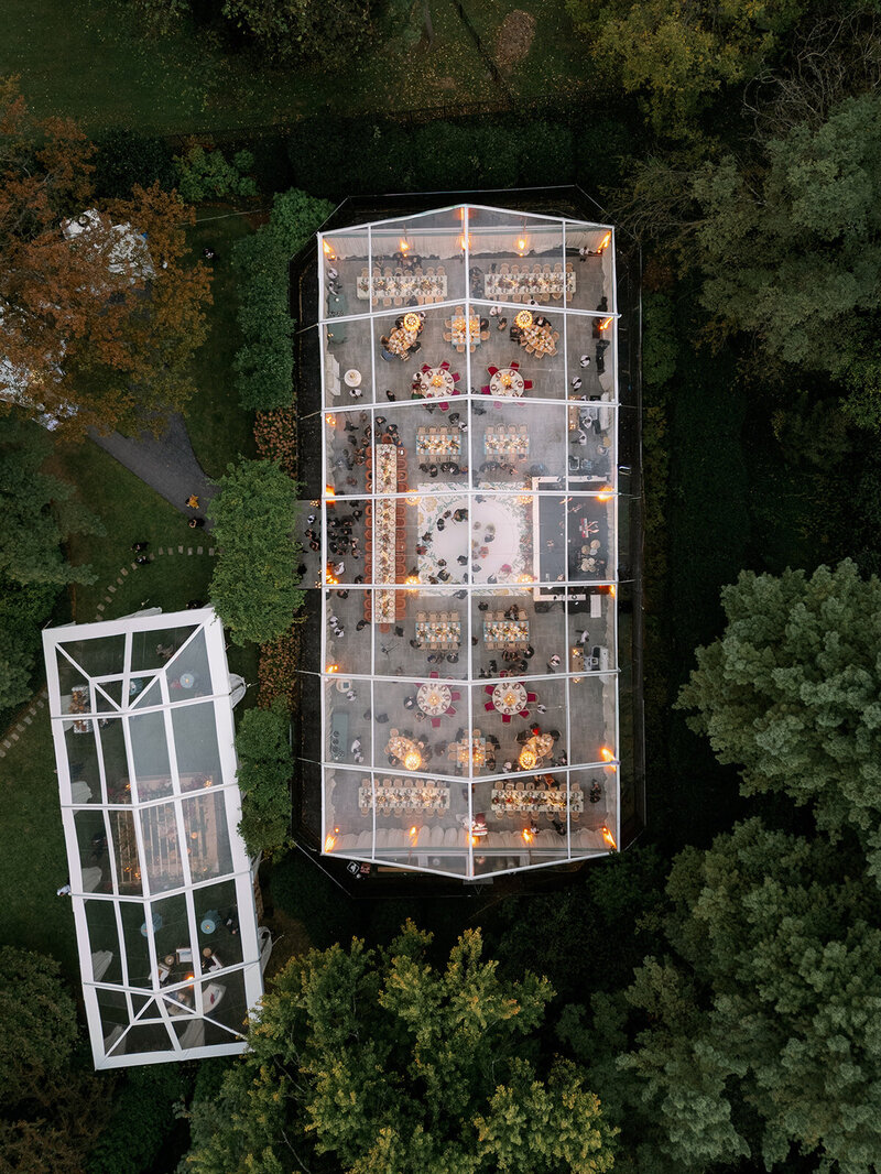 Bridesmaids in mismatched colorful gowns with monochrome flowers for a destination wedding in the mountains at Cedar Lakes Estate