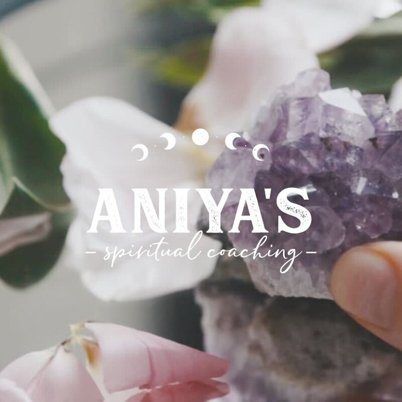 White logo with text "Aniya's Spiritual Coaching" and moon phases illustrations over a purple crystal background