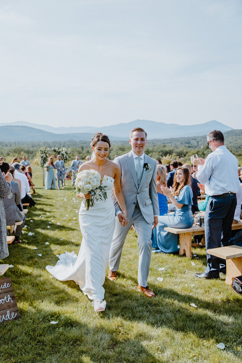 Bride and groom recessional after the ceremony at Public House on Page Hill.