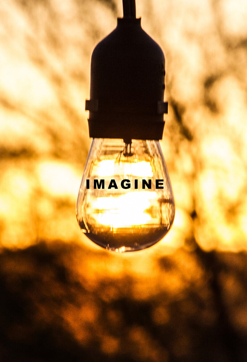 Workspace Branding Image Lightbulb in gold light with word Imagine