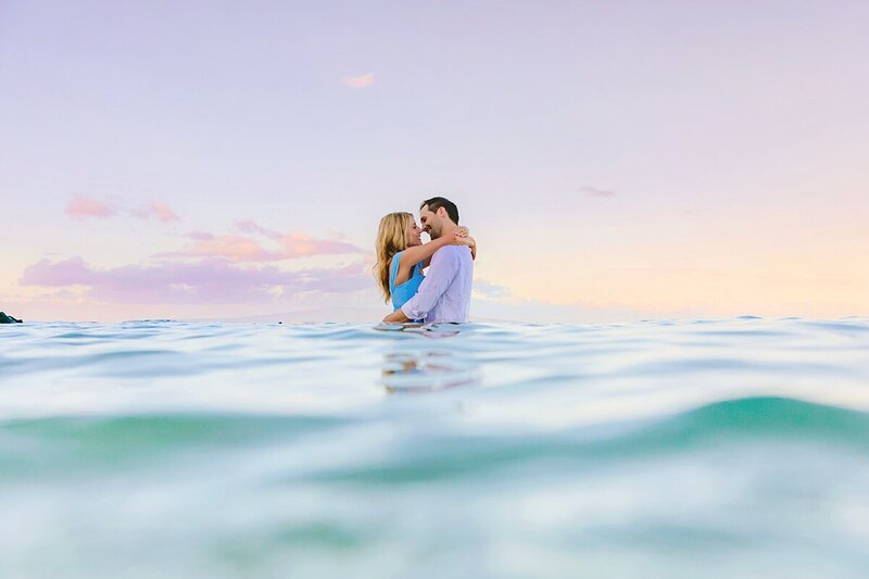 couple poses for maui honeymoon portraits in wailea photographed by love and water
