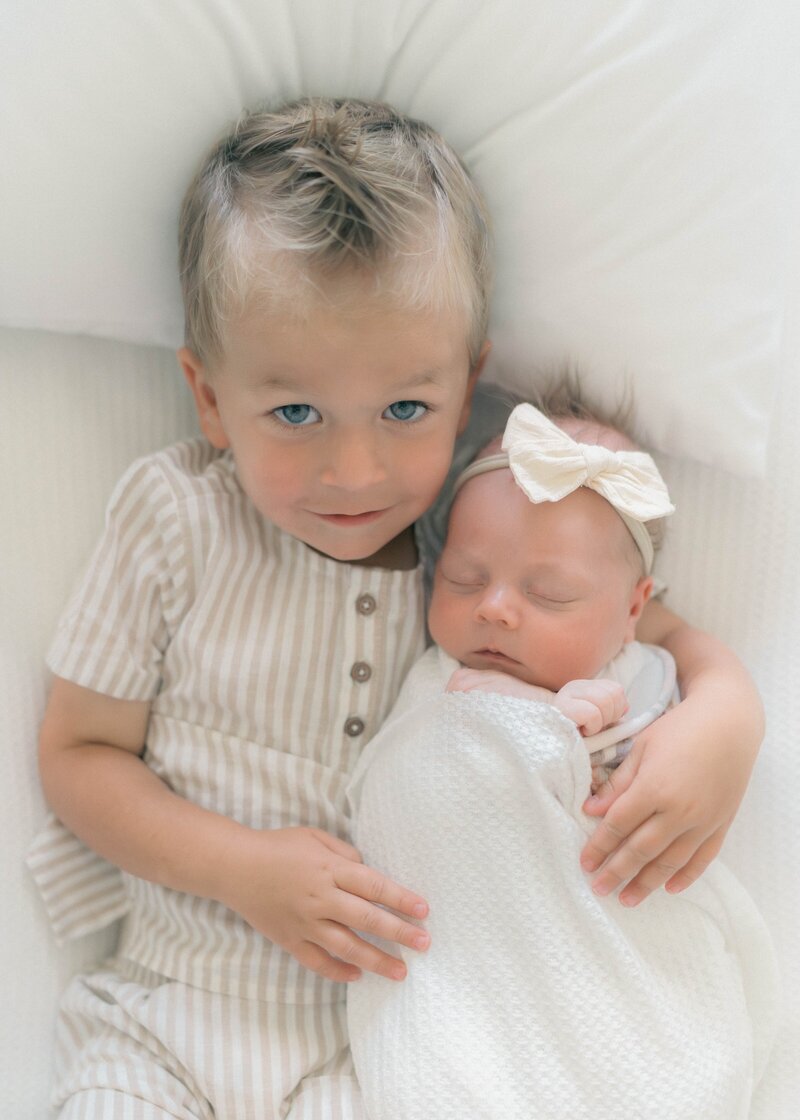 Minimal, natural newborn photography Salt Lake City in a bright home nursery.