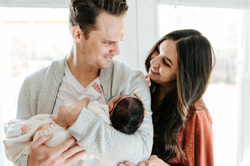 mom and dad with newborn baby