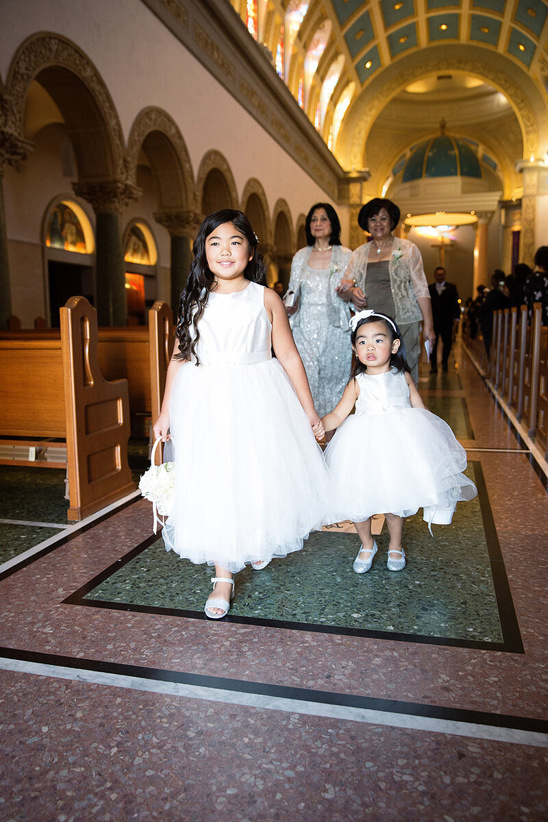 2-radiant-love-events-2-young-flower-girls-walking-out-of-church-ceremony-romantic-elegant-timeless