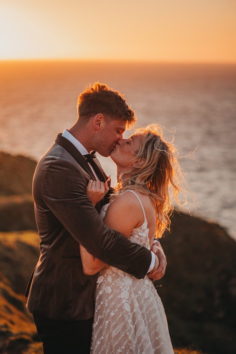 couple embrace in golden light