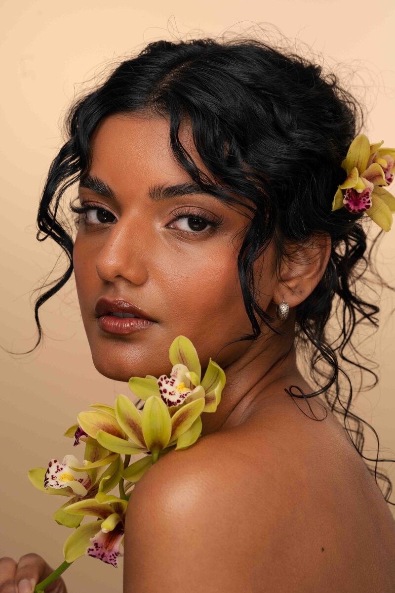 women holding flower