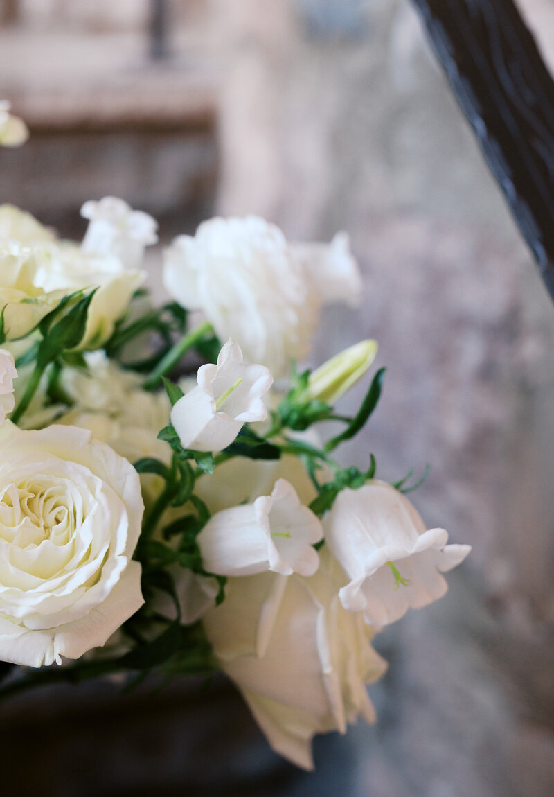 Up close of white wedding flowers on a bridal bouquet.