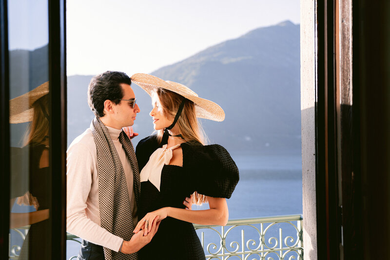 Couple on balcony at Grand Tremezzo in Lake Como, by destination wedding photographer White Orchid Photography