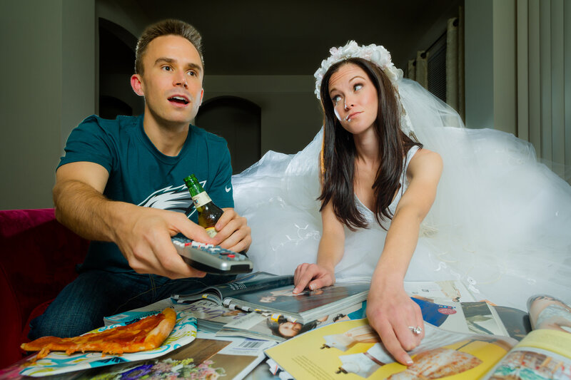 Couple blending their love for the Eagles with wedding planning fun, highlighting their shared passions in a playful engagement session.