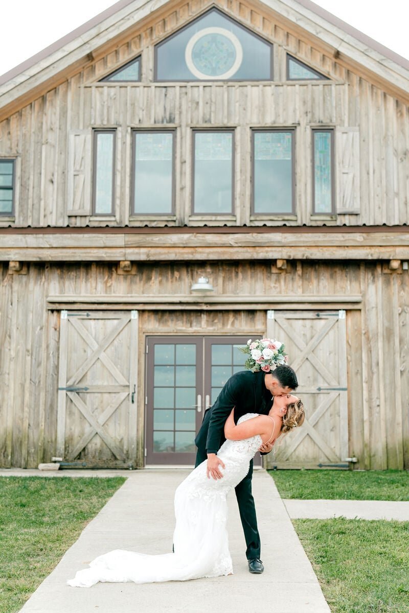 bride-groom-barn-dip-kiss
