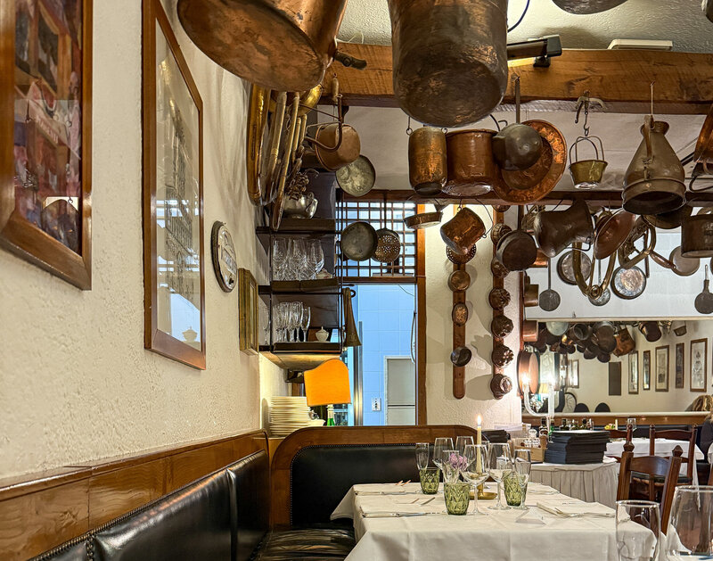 The inside vibe (love all the old pots hung from the ceiling!) at Buca Di Sant'Antonio in Lucca, Italy