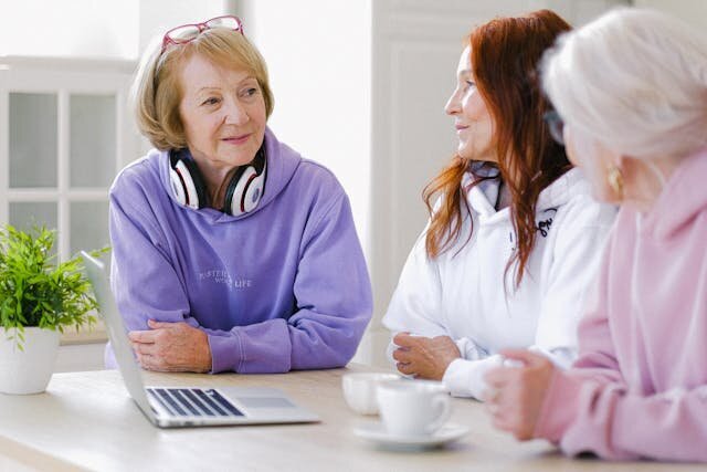 Image of three women having coffee