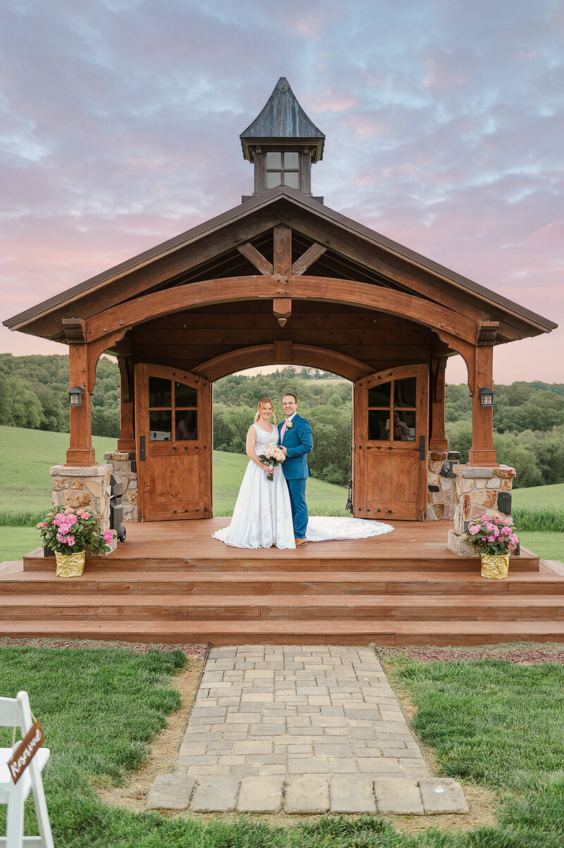 married couple posing at wyndridge farms for their wedding by york and lancaster photographer