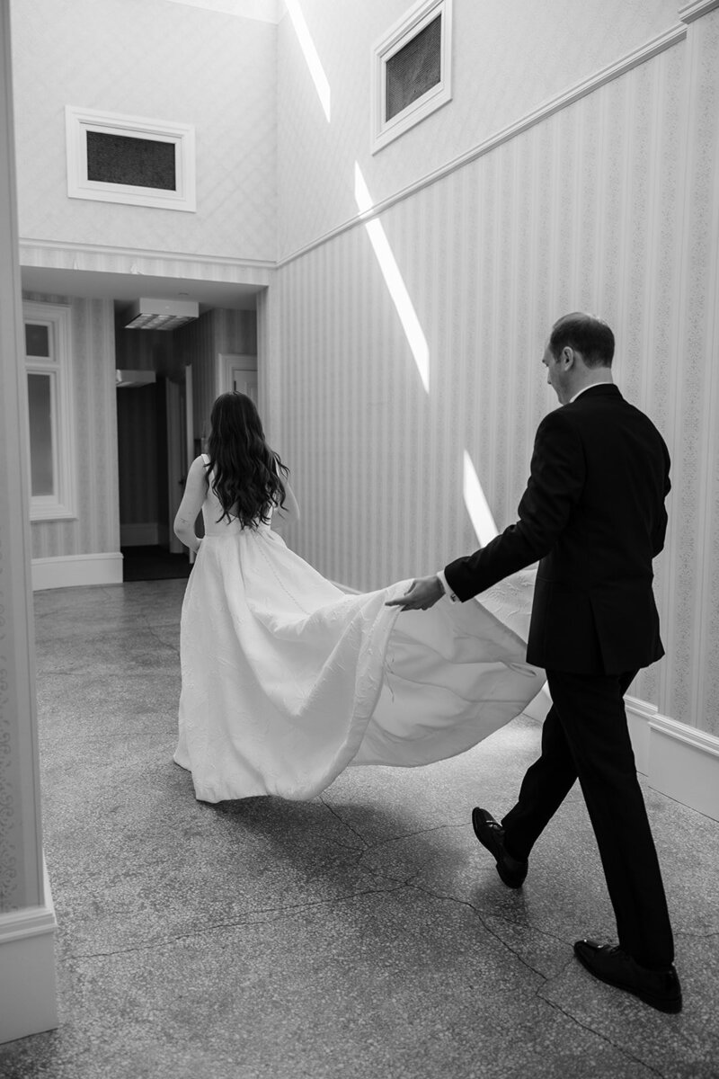 bride-walking-groomsmen-holding-train