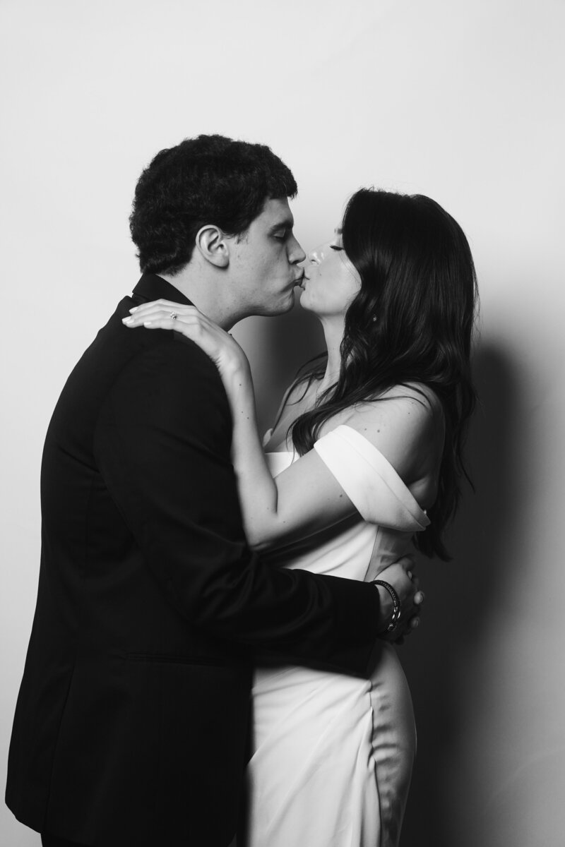 Bride and groom sharing a kiss at The Portrait Parlour guest portrait experience, Cleveland Ohio wedding.

