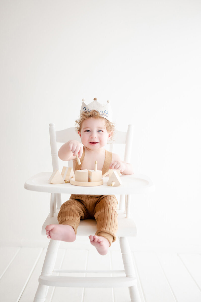 Boy sitting in high chair