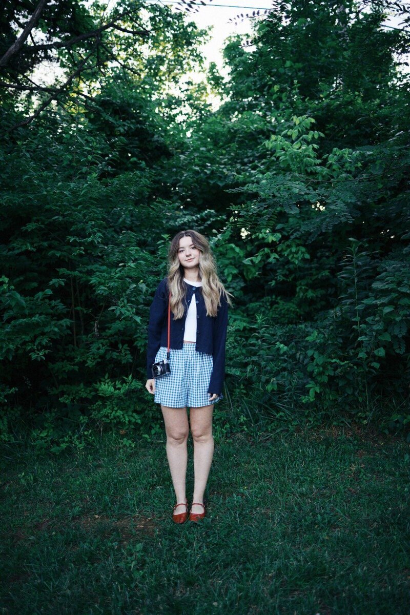 Sammy Mckenzie, wedding photographer in Middle Tennessee, posing with camera
