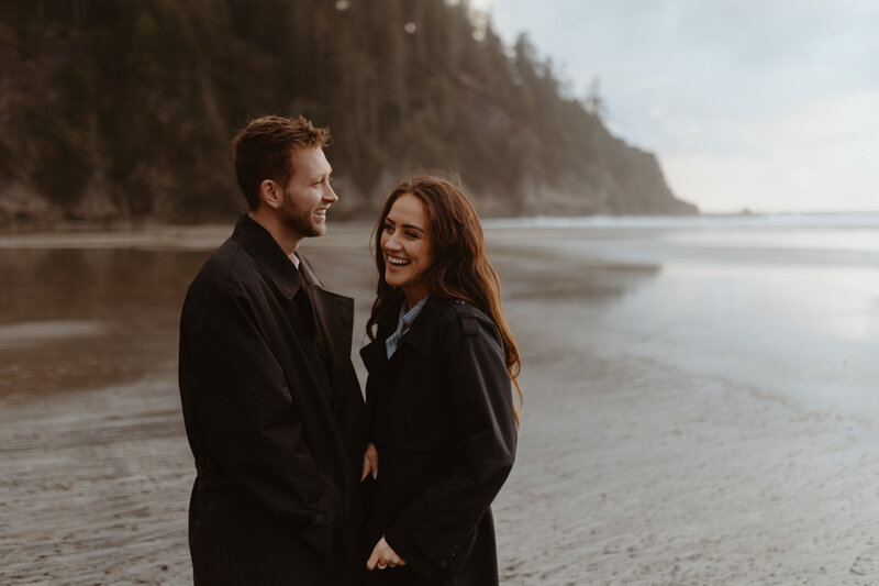 couple holding camera equipement