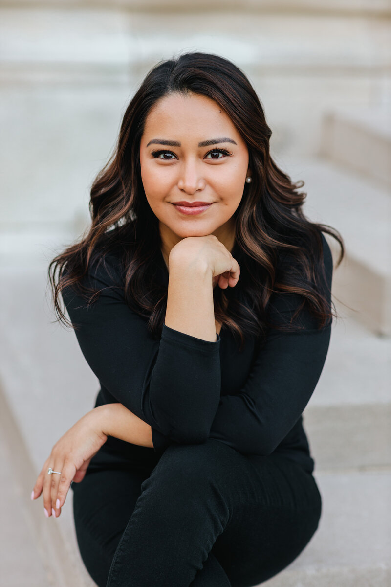 Woman smiling in pantsuit for professional headshot