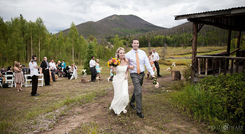 Cute wedding ceremony at the Rowley Homestead at Snow Mountain Rancn in Grand County Colorado