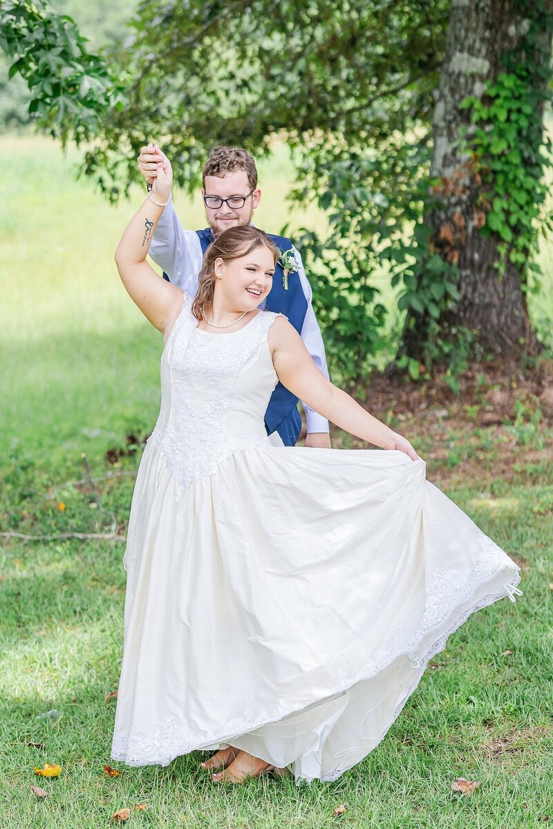 Wedding rings with pearl necklace on blue backdrop | Alabama wedding photographer Amanda Horne