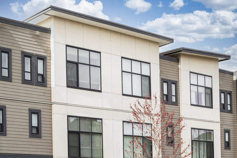 Front of tan multi-family housing