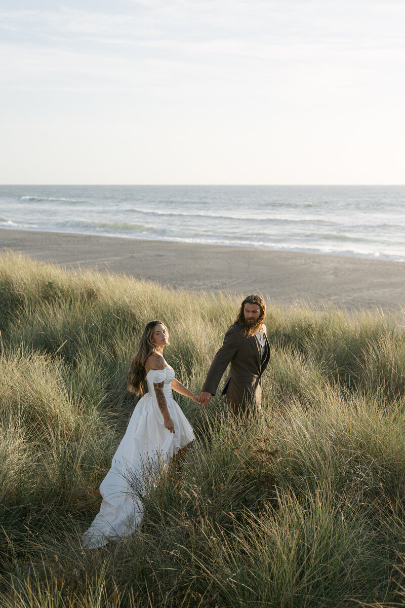 Intimate moment of the couple holding hands and walking together, captured by a Madison wedding photographer.